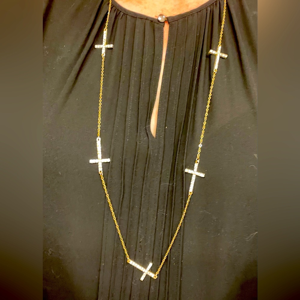 Gold colored cross necklace